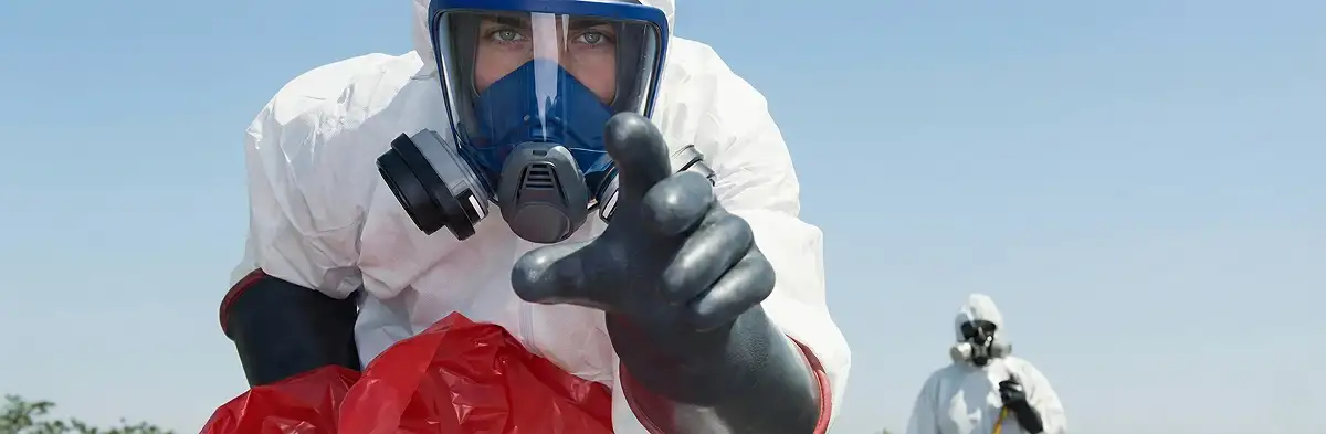 sewage clean up technician wearing protective gear handling biohazard materials in Chandler, AZ
