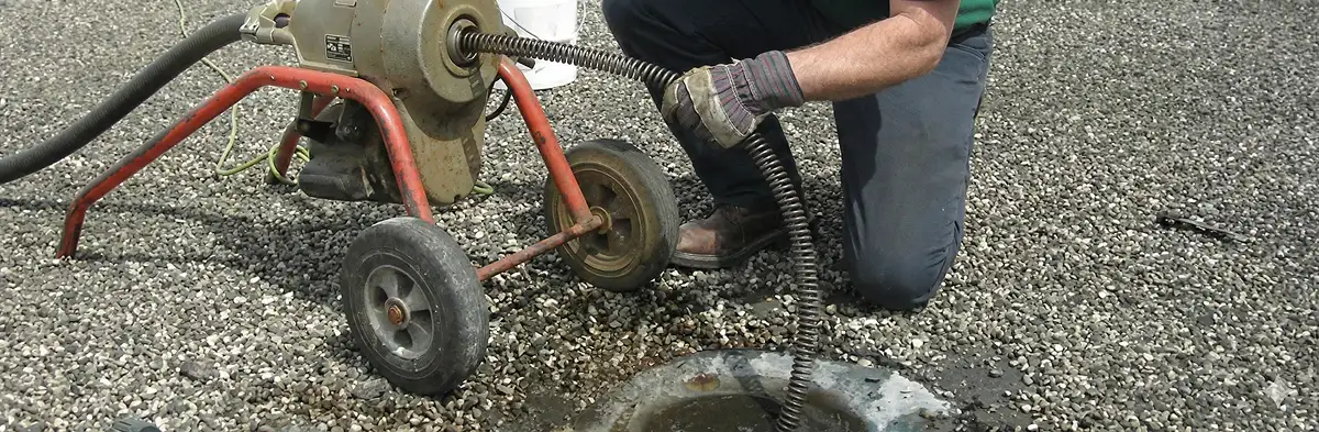 sewer rodding technician actively removing blockages from a sewer line in Chandler, AZ