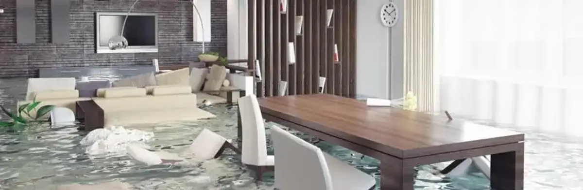 home interior affected by water damage with flooded floors and displaced furniture in Chandler, AZ